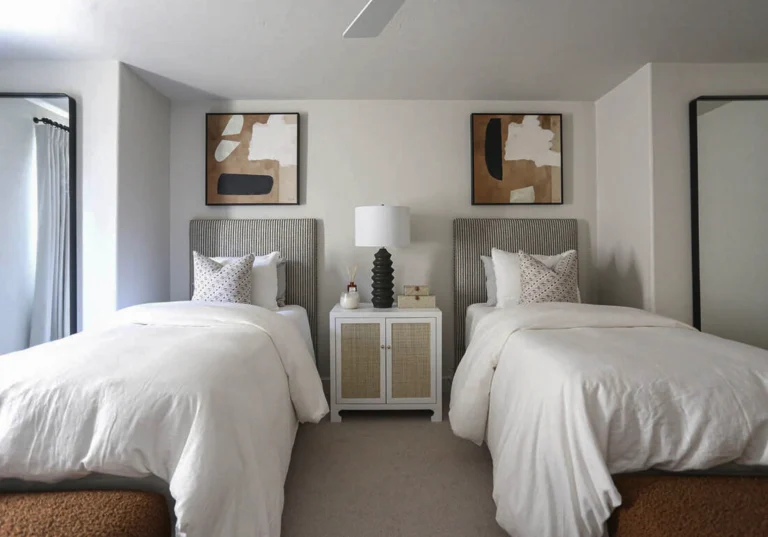 Bedroom with matching twin beds and white painted walls 1