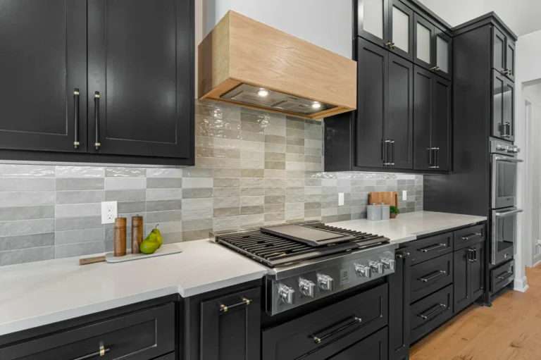 Kitchen with cabinets painted black 1