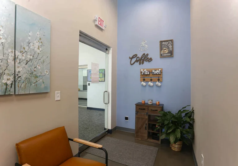 Salon lobby with cream painted walls and a blue painted wall 1