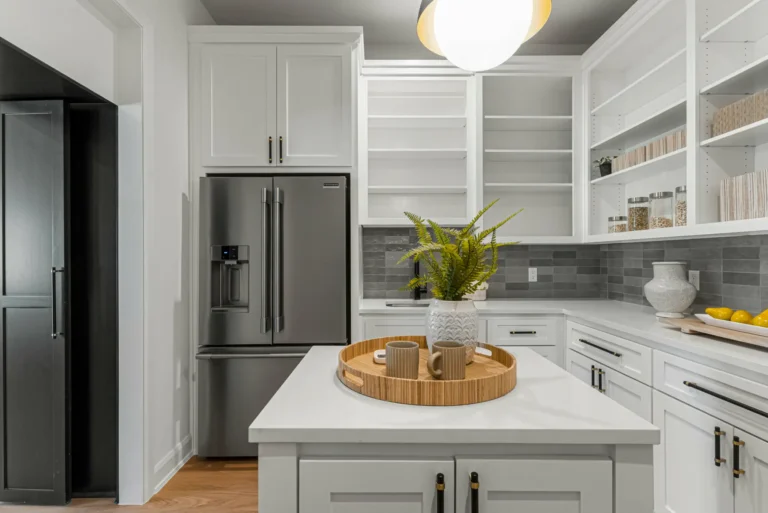 kitchen painted with white cabinets and black door and wall 1